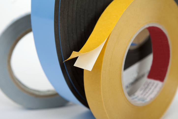 Release coatings and adhesive films